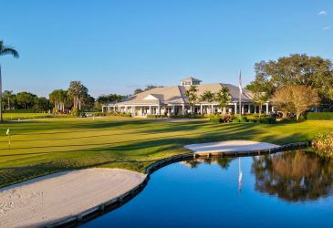 There is a golf club and a lake on the golf course - Delray Dunes Golf & Country Club