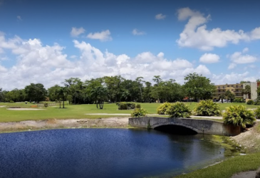 on the golf course there are a lake and lot of trees - City of Lauderhill Golf Course