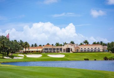 There is a golf club and a lake on the golf course - Trump International West Palm Beach