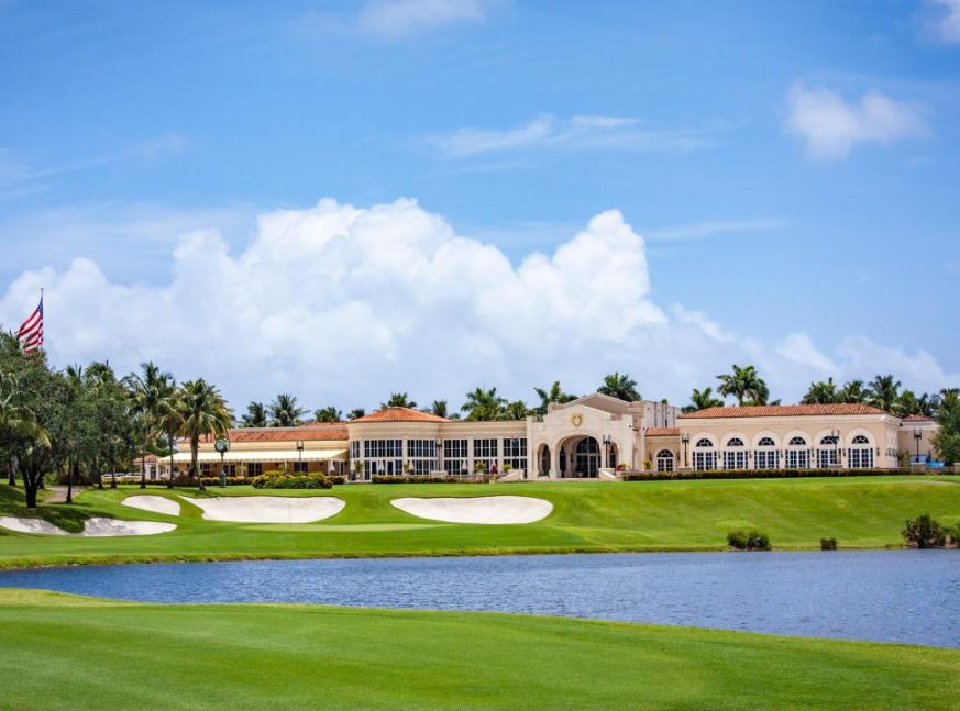 There is a golf club and a lake on the golf course - Trump International West Palm Beach