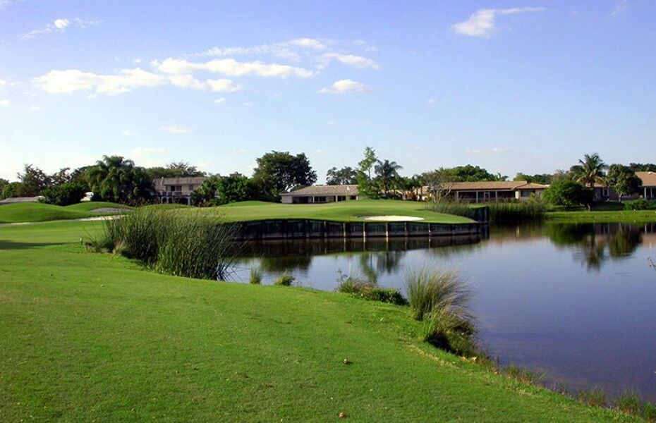 On the golf course, there is a lake and numerous homes