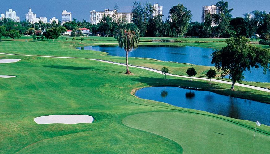 there are a lakes and lot of trees on the golf course - Miami Beach Golf Club