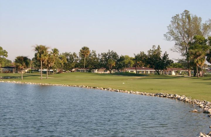 there are a lake and many clubhouses on the golf course - Crystal Lake Country Club of Deerfield Beach