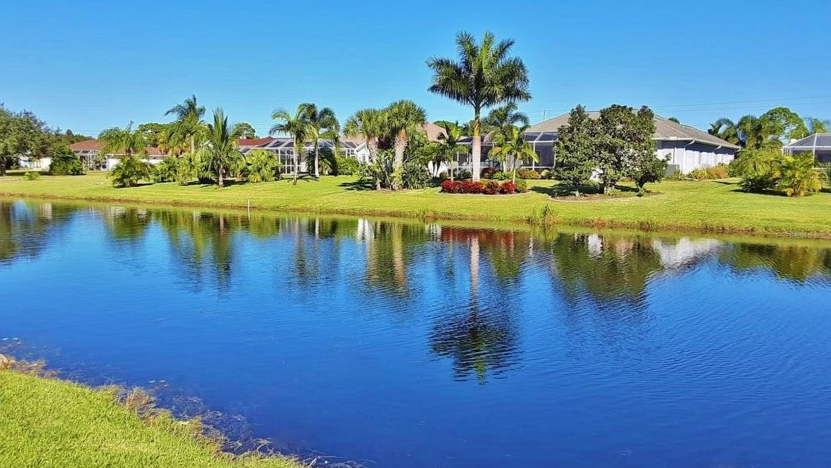 On the golf course, there is a lake and numerous clubhouses - The Cove of Rotonda Golf Center