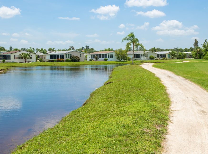 There is a lake and numerous homes on the golf course - Blue Heron Pines