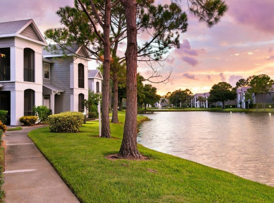 There are many homes on the golf course, as well as a lake - Venice East Golf Club