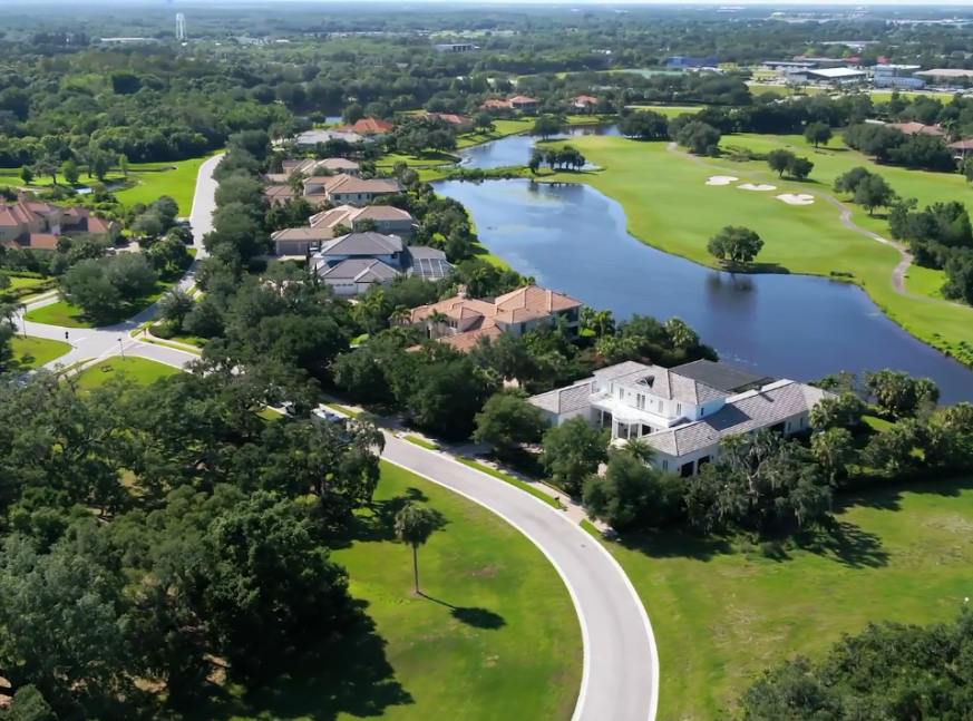 There is a lake and many homes on the golf course at The Founders Golf Club