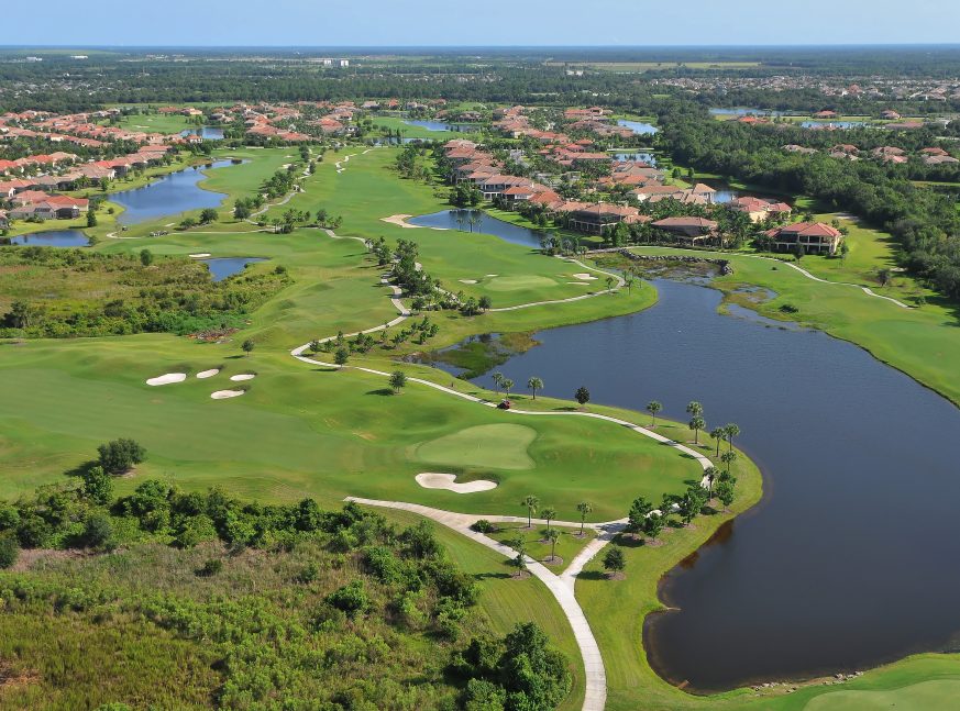 On the Calusa Lakes golf course, there are many homes, lakes, and trees
