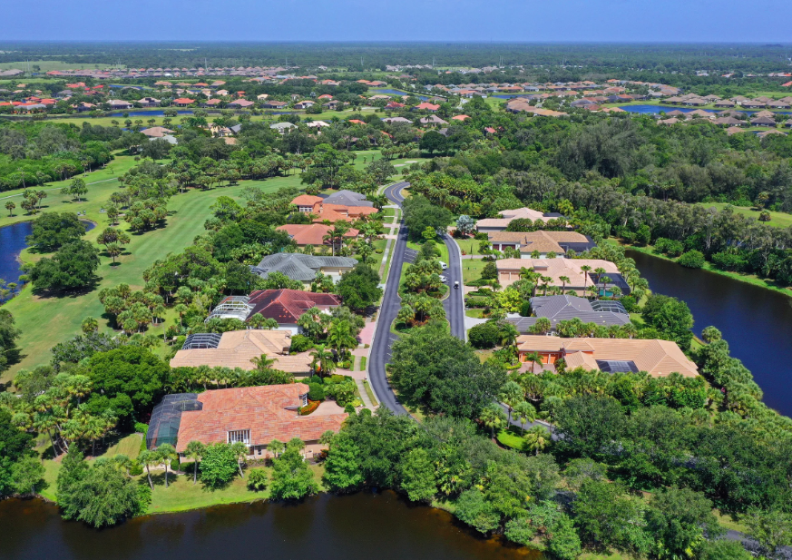 a lot of homes and trees surrounding on the golf course - Boca Royale Golf & Country Club