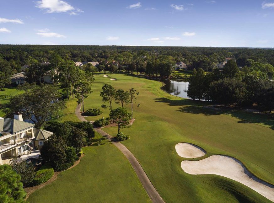 Homes and lakes surrounded by trees with golf courses - Lake Nona Golf & Country Club