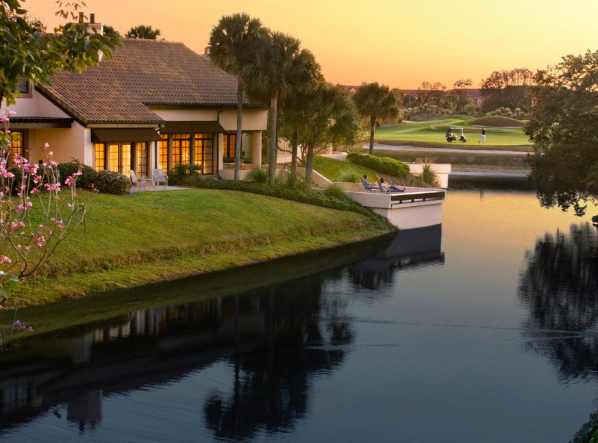 lake and home with golf course at the back - Grand Cypress Golf Club