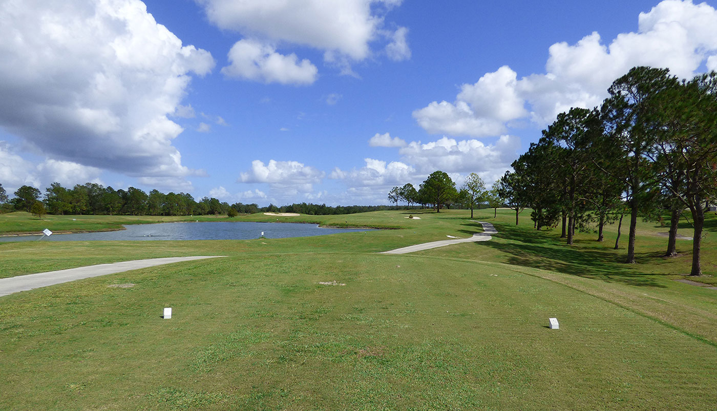 Lakes in the golf course's center, with many trees in the background