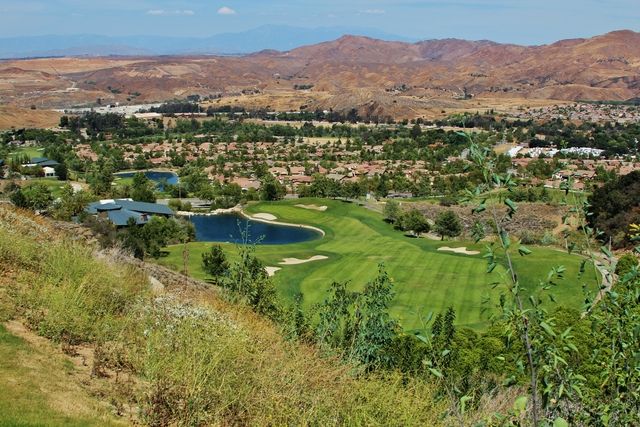 lakes with many trees and homes - Glen Ivy Golf Club