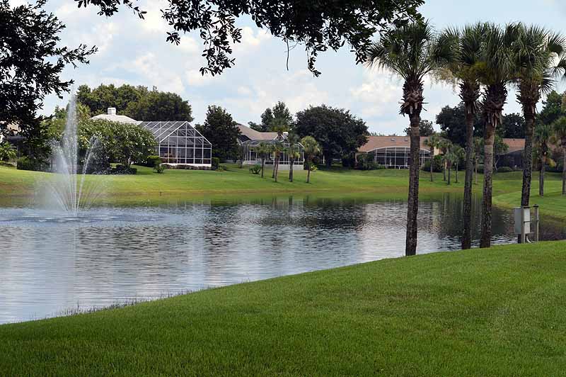 On the golf course, there is a lake with a fountain - Timacuan Golf & Country Club