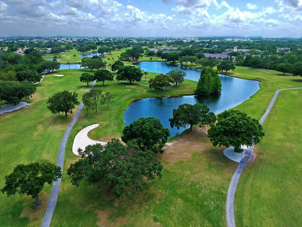 On the golf course, there are numerous lakes, as well as numerous trees and houses