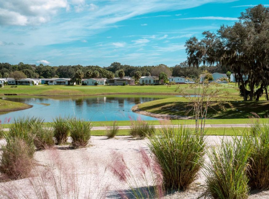 On the golf course, there is a lake and numerous houses - The Villages of Orange Blossom Gardens and Silver Lake