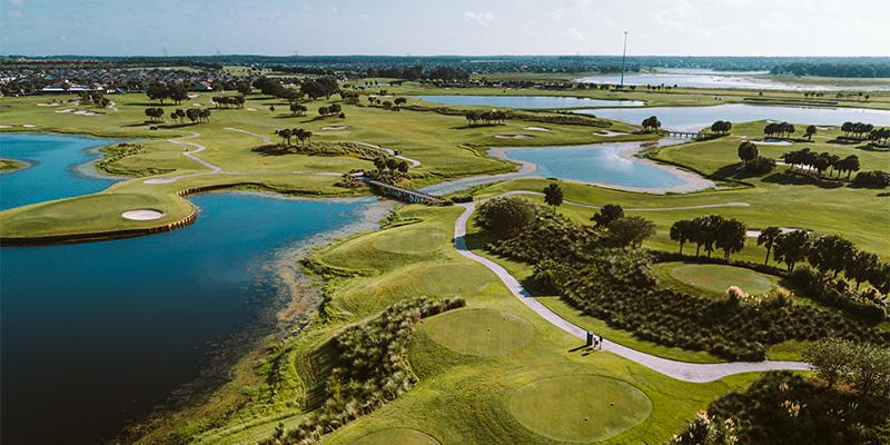 Above view of the lakes and trees on the golf course - Belle Glade Country Club
