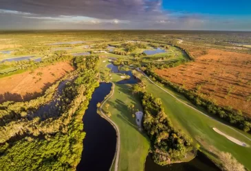 There are lakes and trees on golf course in Myakka Pines Golf Club
