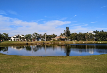 Lake and house on the golf course - Alden Pines Country Club