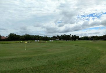 Golf course with yellow flag pole - El Rio Golf Club
