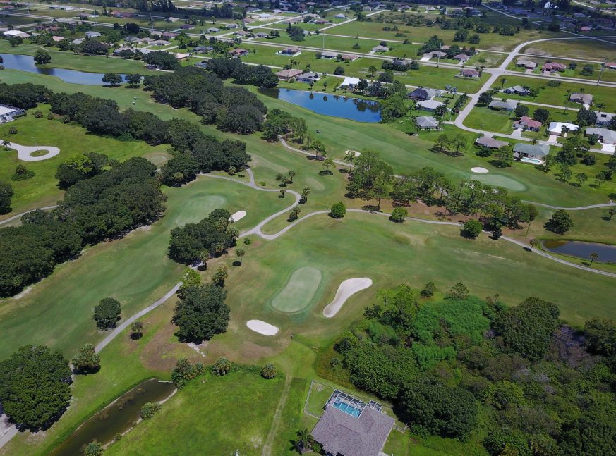 Lakes and trees in golf course - Coral Oaks Golf Course