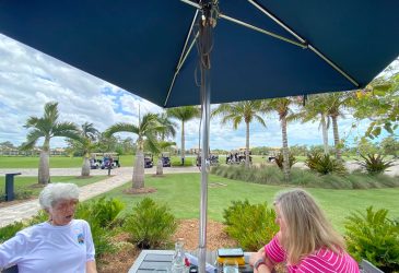 2 people eating in Pelican Sound Golf and River Club