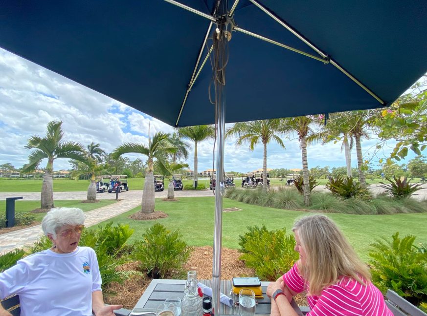 2 people eating in Pelican Sound Golf and River Club