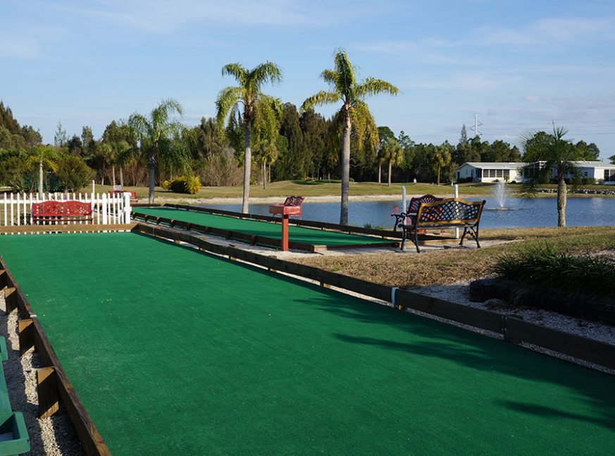 lake and bocce court - Pine Lakes Country Club