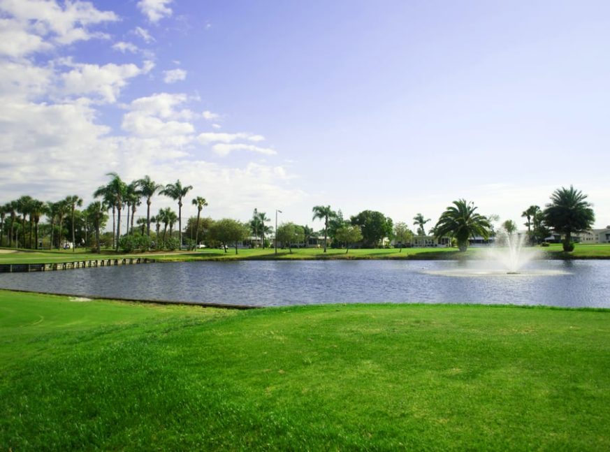 golf course with lake - Six Lakes Country Club