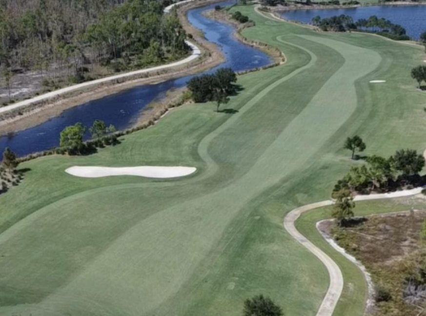 Trees surrounded the golf course with lake - Esplanade Golf and Country Club of Naples